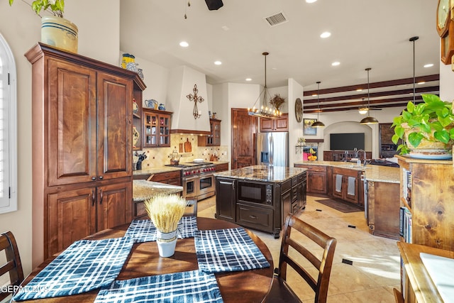 kitchen featuring tasteful backsplash, visible vents, ceiling fan, light stone countertops, and appliances with stainless steel finishes