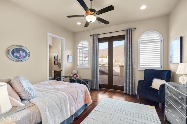 bedroom featuring access to outside, recessed lighting, dark wood-style flooring, and a mountain view