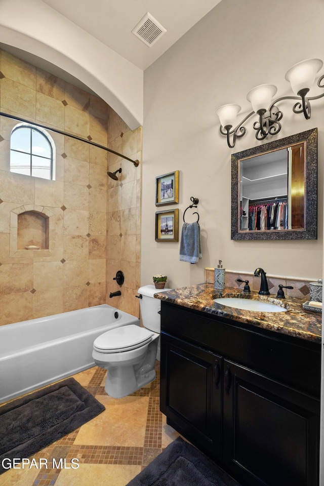 full bath with tile patterned floors, visible vents, toilet, shower / bath combination, and vanity