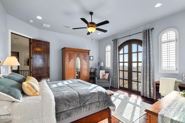 bedroom with recessed lighting, visible vents, multiple windows, and wood finished floors