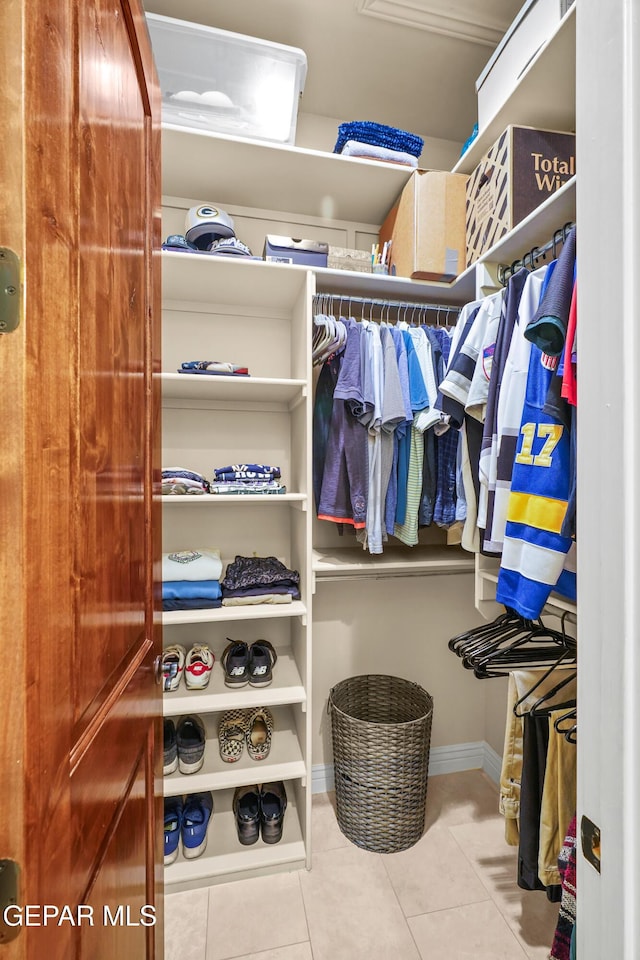 spacious closet with tile patterned flooring