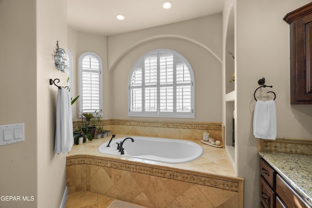 full bathroom featuring recessed lighting and a bath