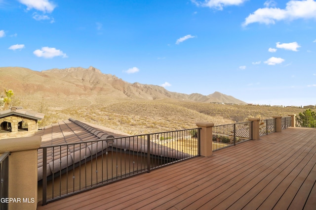 wooden deck with a mountain view