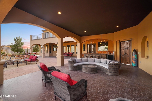 view of patio / terrace with an outdoor living space and a balcony