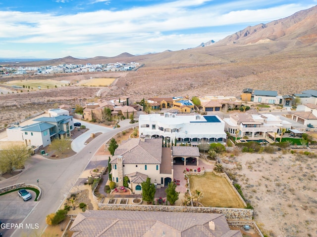 birds eye view of property featuring a mountain view and a residential view