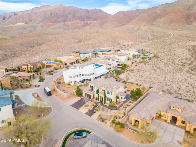 drone / aerial view featuring a residential view and a mountain view