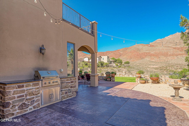 1408 Via Quijano Ln, El Paso, TX 79912 - patio / terrace with a patio area, exterior kitchen, and a mountain view