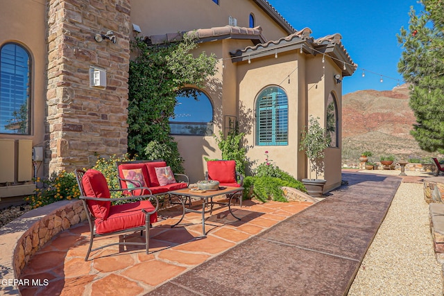 1408 Via Quijano Ln, El Paso, TX 79912 - view of patio / terrace featuring a mountain view and an outdoor hangout area