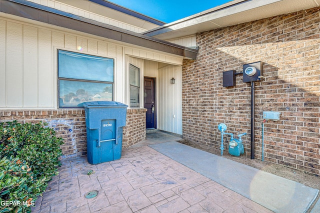 exterior space with brick siding