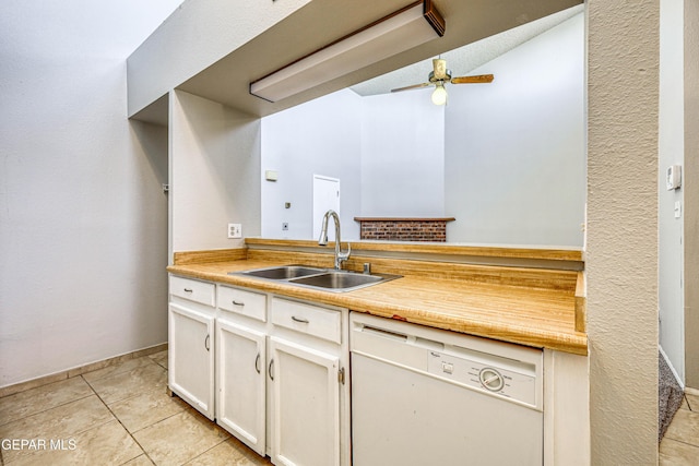 kitchen with light countertops, white dishwasher, light tile patterned flooring, a ceiling fan, and a sink