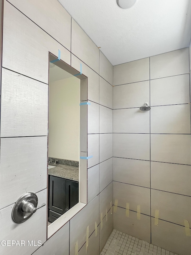 interior space featuring a tile shower