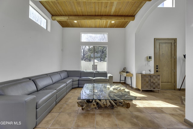 tiled living room featuring wooden ceiling, high vaulted ceiling, and beam ceiling