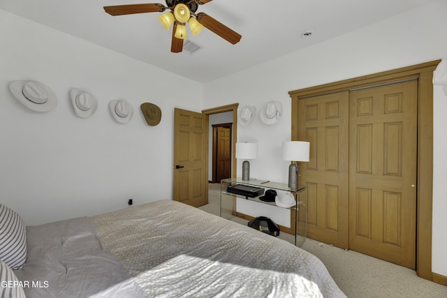 bedroom featuring a ceiling fan, baseboards, visible vents, and carpet flooring