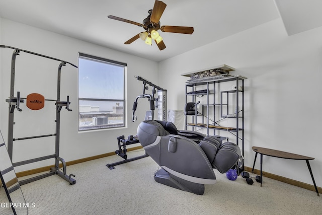 workout room featuring a ceiling fan and baseboards