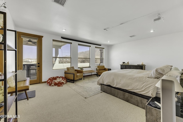 bedroom with carpet floors, recessed lighting, visible vents, and access to exterior