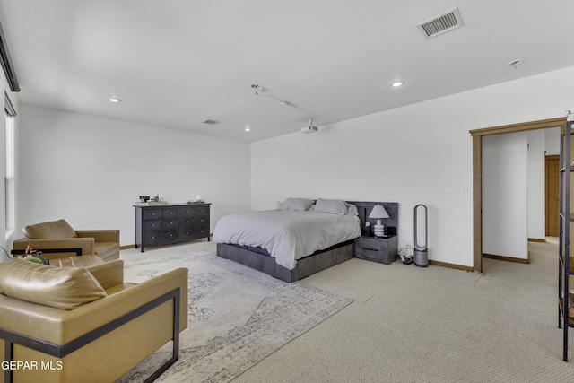 bedroom with light carpet, recessed lighting, visible vents, and baseboards