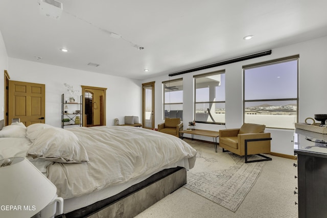 carpeted bedroom with baseboards and recessed lighting