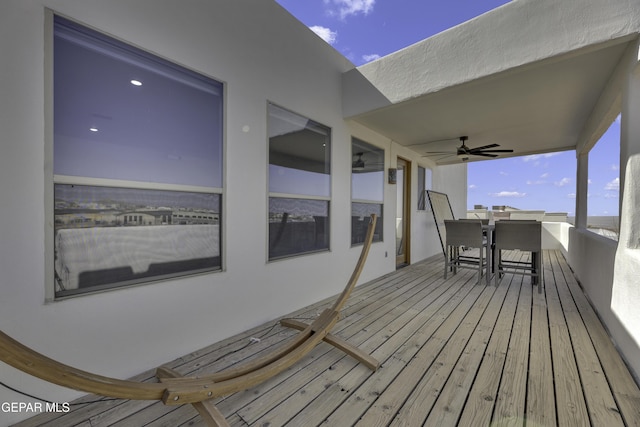 wooden terrace with a ceiling fan