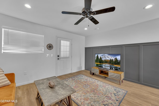 living area featuring recessed lighting, a ceiling fan, and light wood finished floors