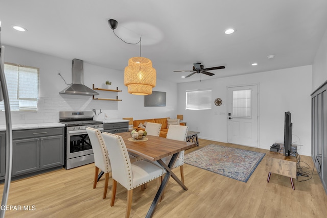 dining space with recessed lighting, light wood-type flooring, and a ceiling fan