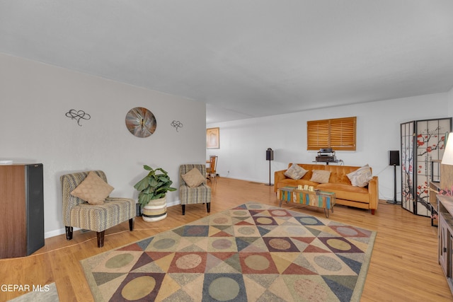 living area featuring wood finished floors and baseboards