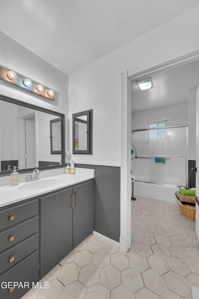 bathroom featuring shower / washtub combination and vanity