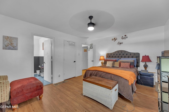 bedroom featuring light wood-type flooring and ceiling fan