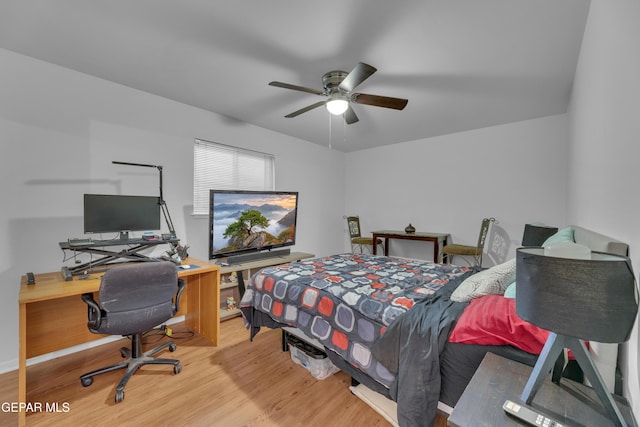 bedroom with a ceiling fan and wood finished floors