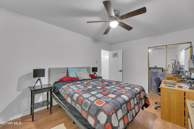 bedroom featuring a ceiling fan and light wood-style floors