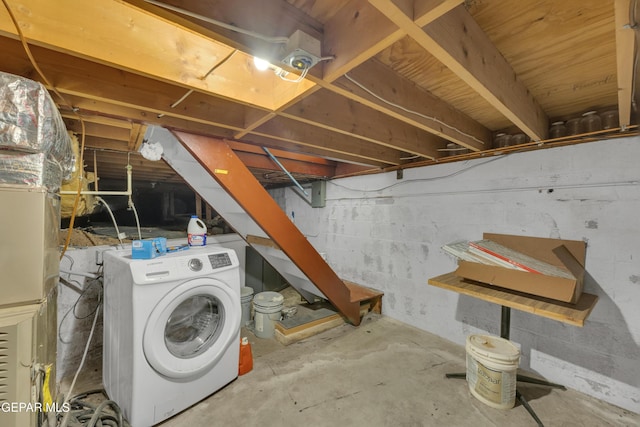 unfinished basement with washer / clothes dryer