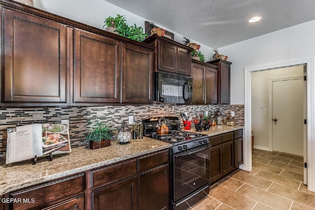 kitchen with a textured ceiling, dark brown cabinetry, backsplash, light stone countertops, and black appliances