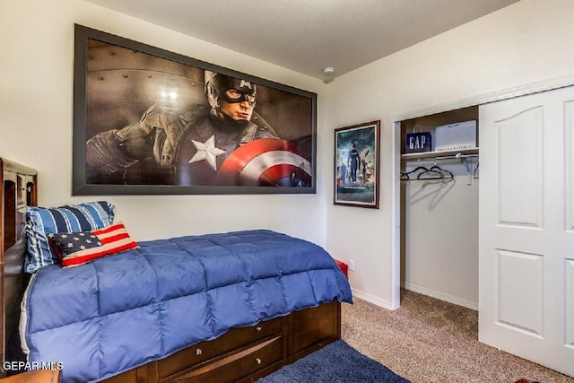 bedroom with carpet, baseboards, and a closet