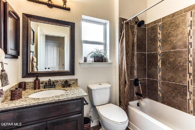 full bathroom with shower / bath combo, vanity, and toilet