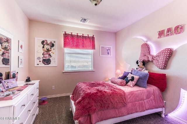 bedroom featuring baseboards, visible vents, and dark carpet