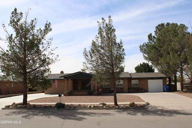 ranch-style home with driveway and an attached garage