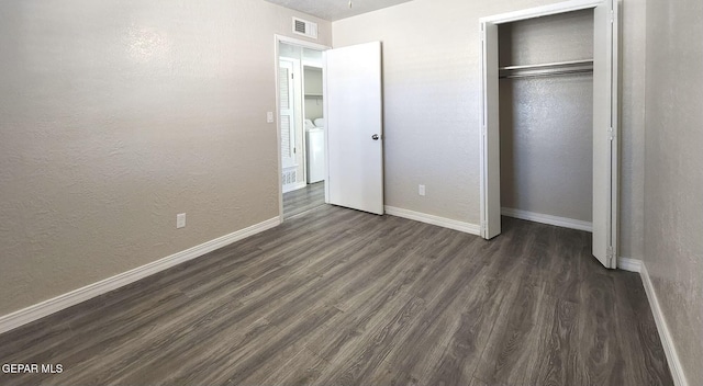 unfurnished bedroom with visible vents, baseboards, a textured wall, a closet, and dark wood-style flooring