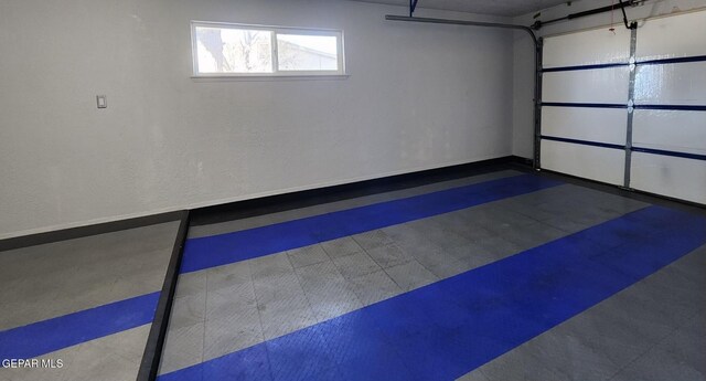 garage featuring baseboards