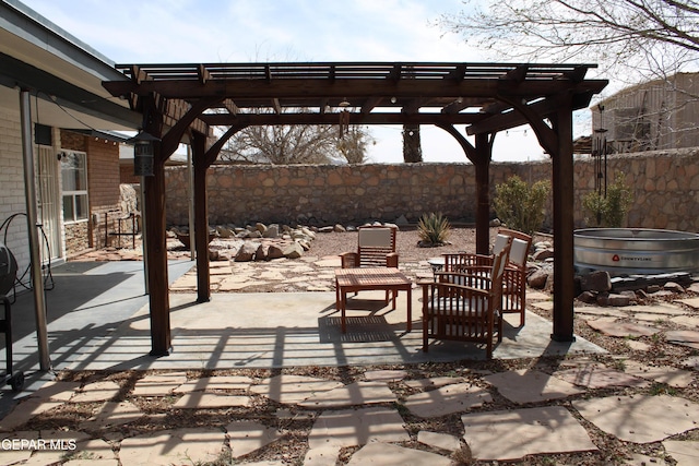 view of patio / terrace featuring a fenced backyard and a pergola