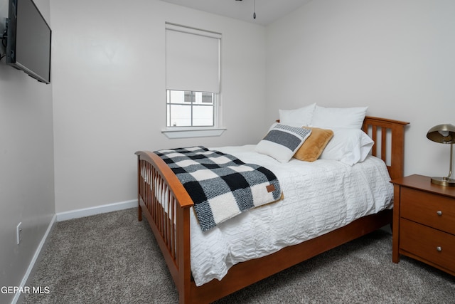 bedroom with carpet flooring and baseboards