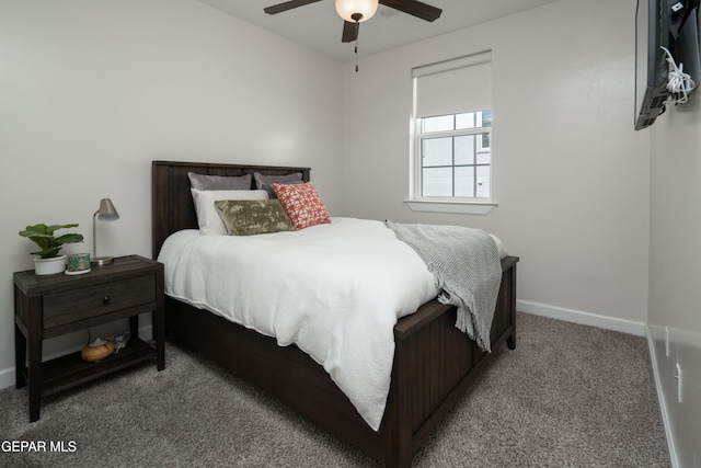 carpeted bedroom featuring a ceiling fan and baseboards