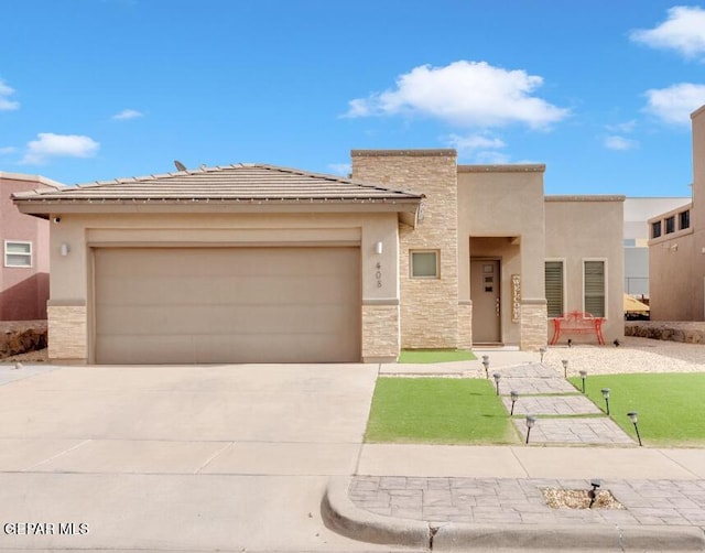 view of front of house with a garage, stone siding, concrete driveway, and stucco siding