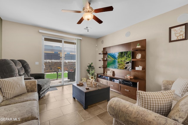 living room featuring ceiling fan and light tile patterned flooring