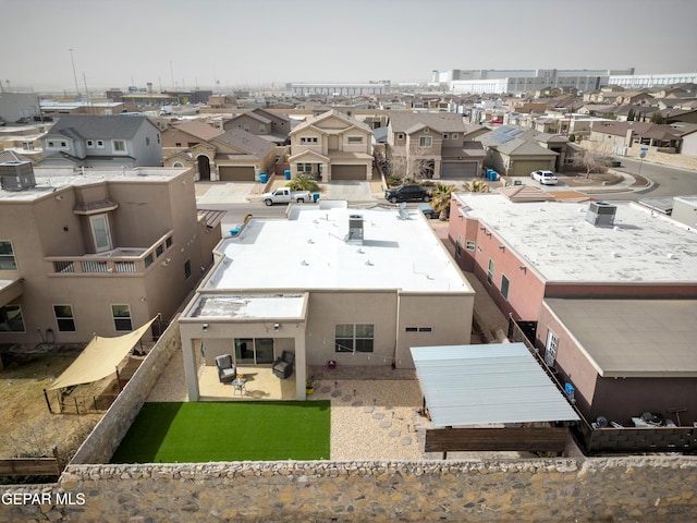 birds eye view of property with a residential view