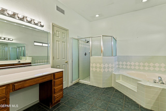 full bath featuring visible vents, a garden tub, a stall shower, tile patterned flooring, and vanity