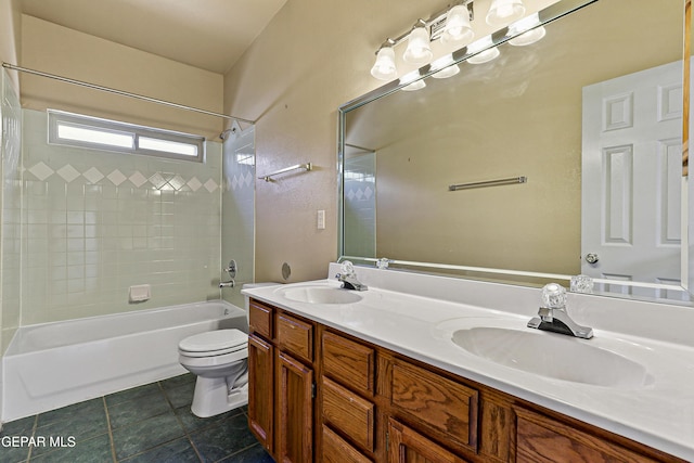 full bath with a sink, toilet, double vanity, and bathing tub / shower combination