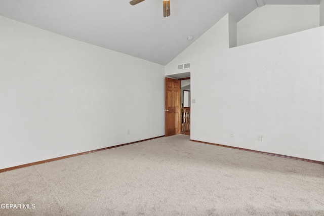 unfurnished room with visible vents, high vaulted ceiling, carpet floors, baseboards, and ceiling fan