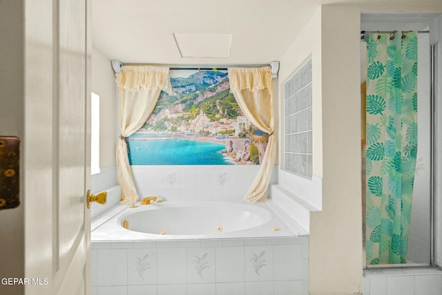 bathroom with a tub with jets and a shower with shower curtain