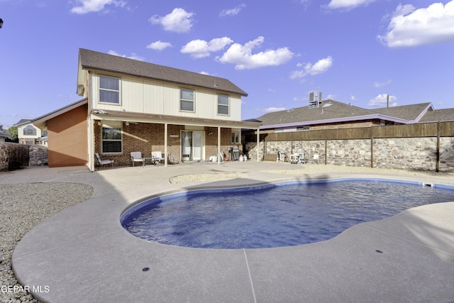 view of pool with a patio area, a fenced backyard, and a fenced in pool