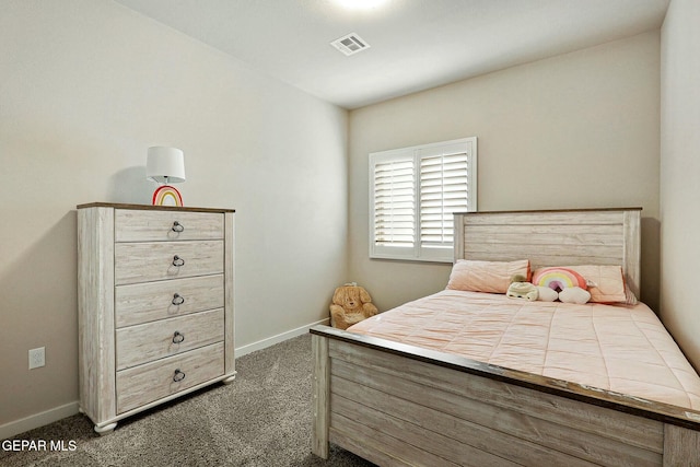 bedroom featuring visible vents, dark carpet, and baseboards