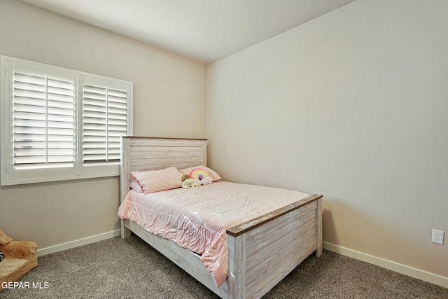 carpeted bedroom with baseboards